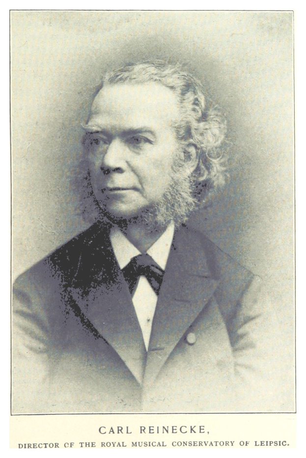 Schwarzes und weißes Foto von Carl Reinecke, Direktor des Königlichen Musikalischen Konservatoriums Leipzig, der einen Anzug trägt, mit Text unten.