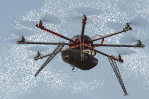Eine Drohne fliegt über ein Gebäude mit einem Mast im Vordergrund und einem klaren blauen Himmel im Hintergrund.