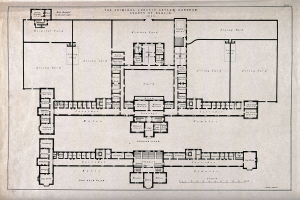 Schwarz-weißer Architekturplan eines Gebäudes mit zahlreichen beschrifteten Räumen, darunter eine 'Irrenanstalt für Verbrecher', begleitet von handgeschriebenem Text.