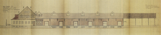 Eine handgezeichnete Grundrissplan für ein neues Schulgebäude mit zahlreichen Fenstern, skizziert auf Papier mit begleitendem Text.