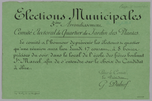 Ein grünes Papier mit der Aufschrift "Elections municipales" auf einem weißen Hintergrund.